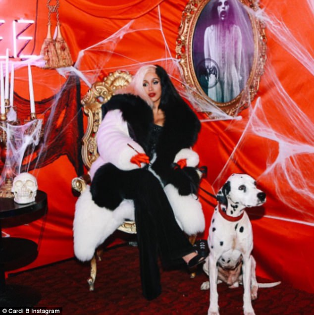 Cardi B dressed as cruella de vil in a fox fur coat for halloween party