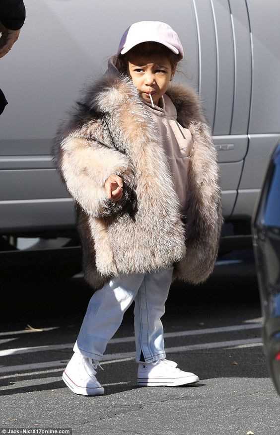 baby North West in fur coat