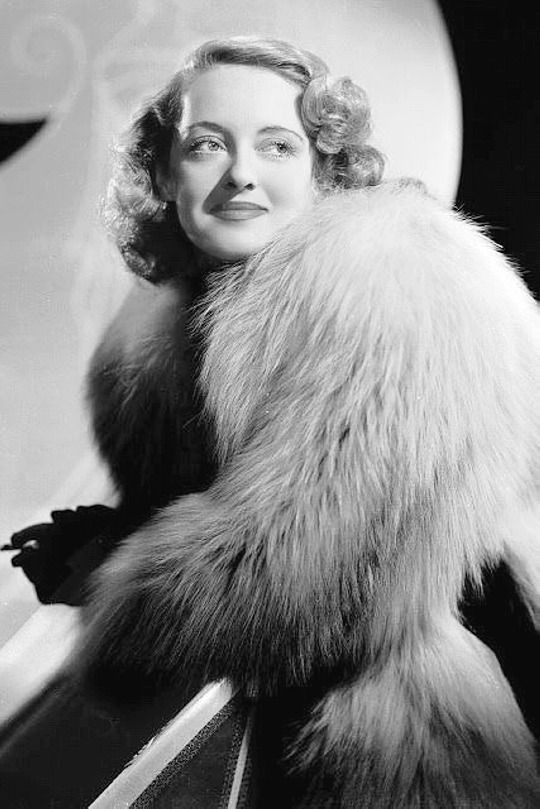 Bette Davis, wearing fox fur jacket 1938
