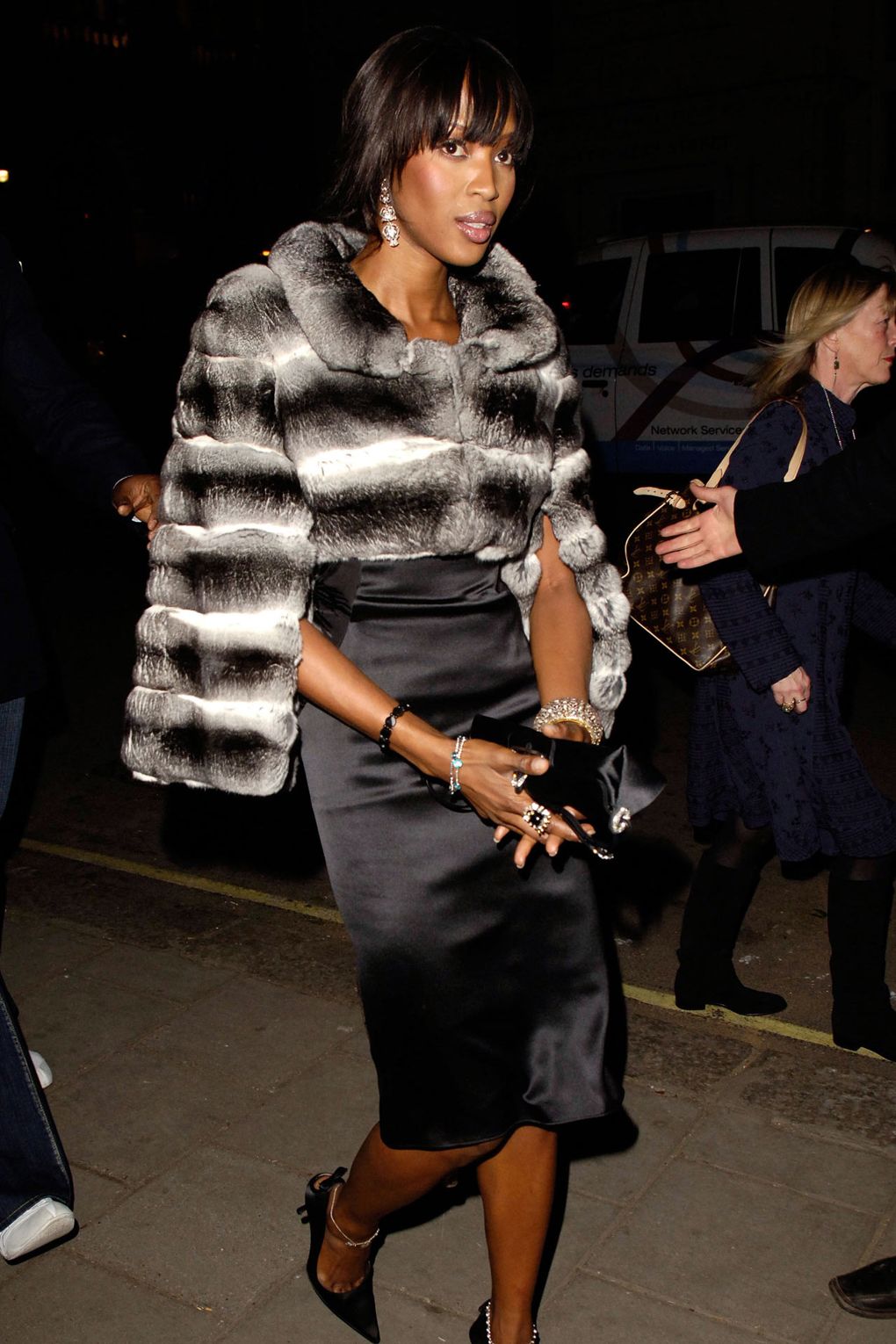 During London Fashion Week, American and British Vogues hosted a cocktail party where she wore a Dolce & Gabbana fur coat.