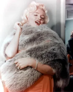 Merilyn wearing  a large fox fur stole.